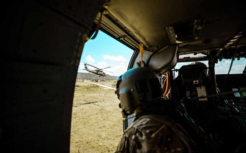 Defence & Intelligence - Soldier in helicopter